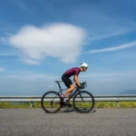 cyclist against a background of fields and sky