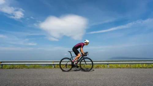 cyclist against a background of fields and sky