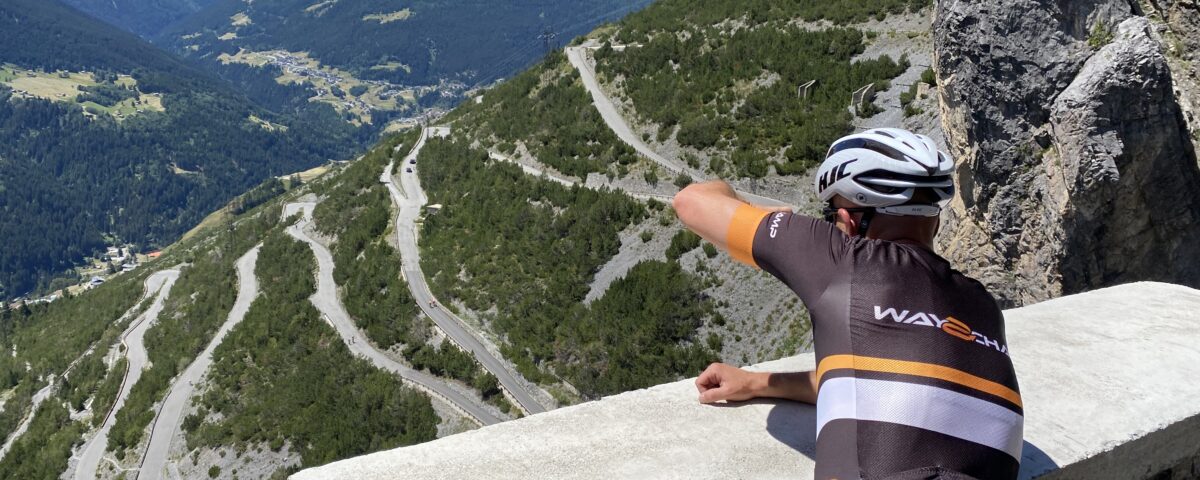 cyclist takes a picture of the mountain route