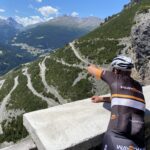 cyclist takes a picture of the mountain route