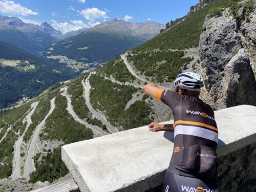 cyclist takes a picture of the mountain route
