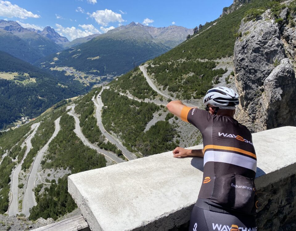 cyclist takes a picture of the mountain route